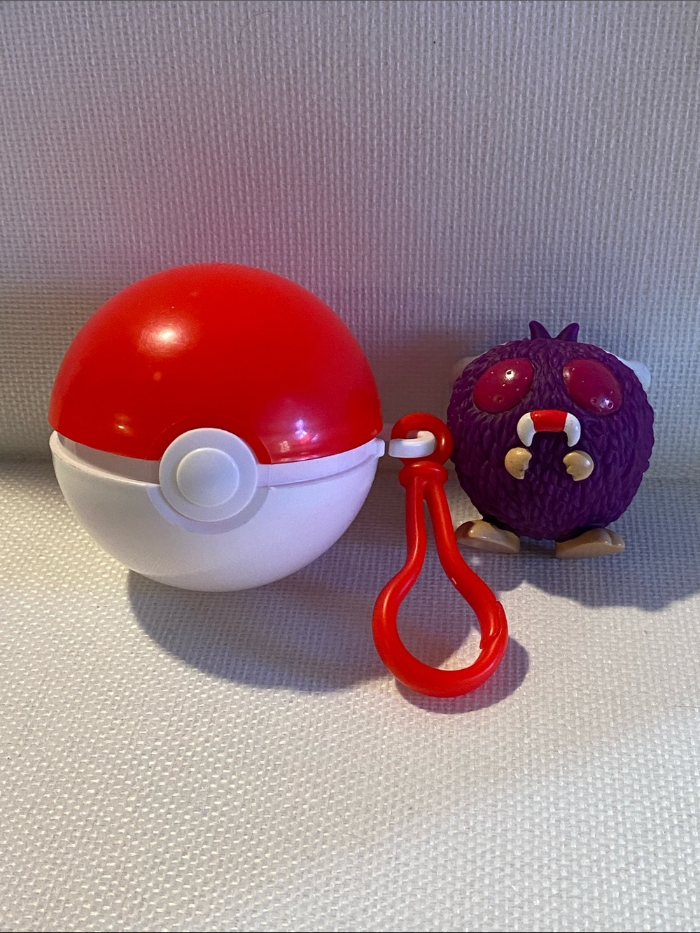 vintage 1999 Burger King Pokémon Pokéball toy with a Venonat spinner top figure.